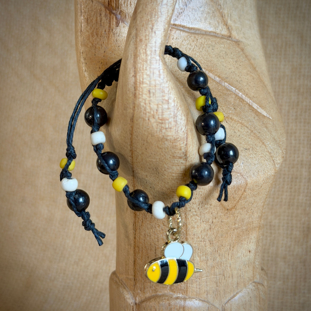 Adjustable Shungite Bracelet for Kids | Bizzy Bumblebee on wooden arm
