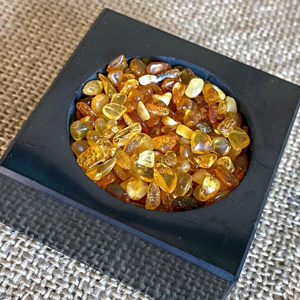 Carved Onyx Dragon Skull on Tumbled Amber in Shungite Tea Light Holder