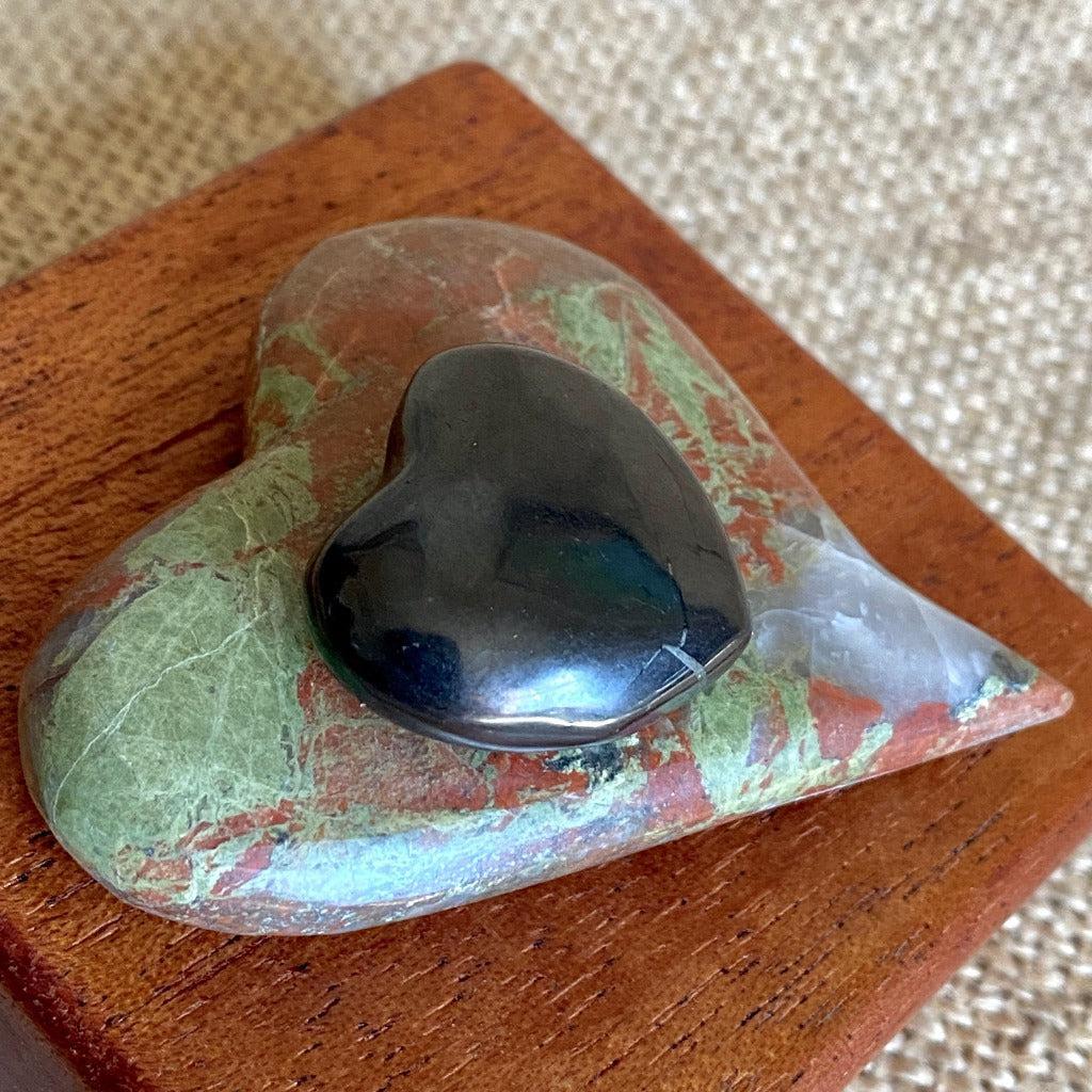 Playful Carved Stone Heart & Black Shungite Heart on Mahogany Stand