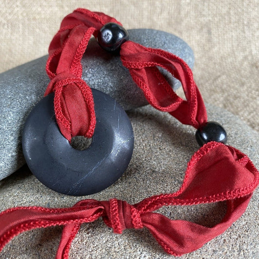 Hangable Shungite Donut Accessory on Hand-Dyed Red Silk