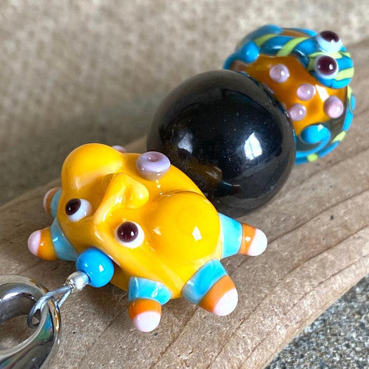 Shungite Clip-on, Necklace, Whimsical Orange Sun Face, Lampwork Glass