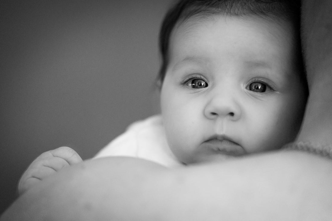 Black and white portrait of a baby — protecting children from EMF exposure