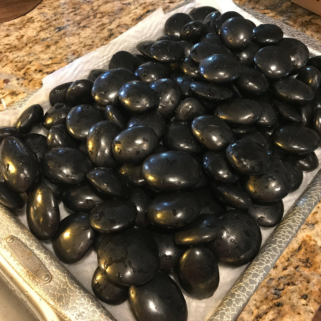 black shungite stones on a tray