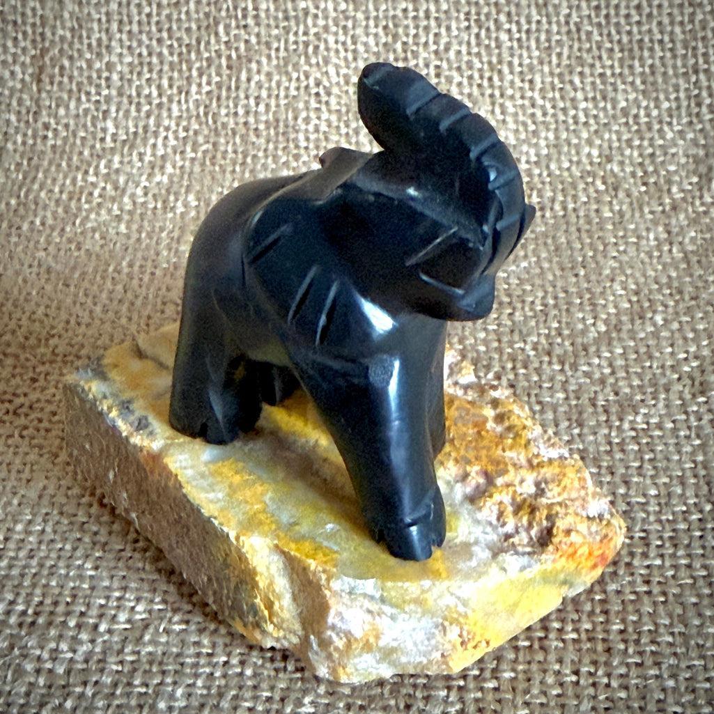 Carved Shungite Elephant | On Bumblebee Jasper Slab