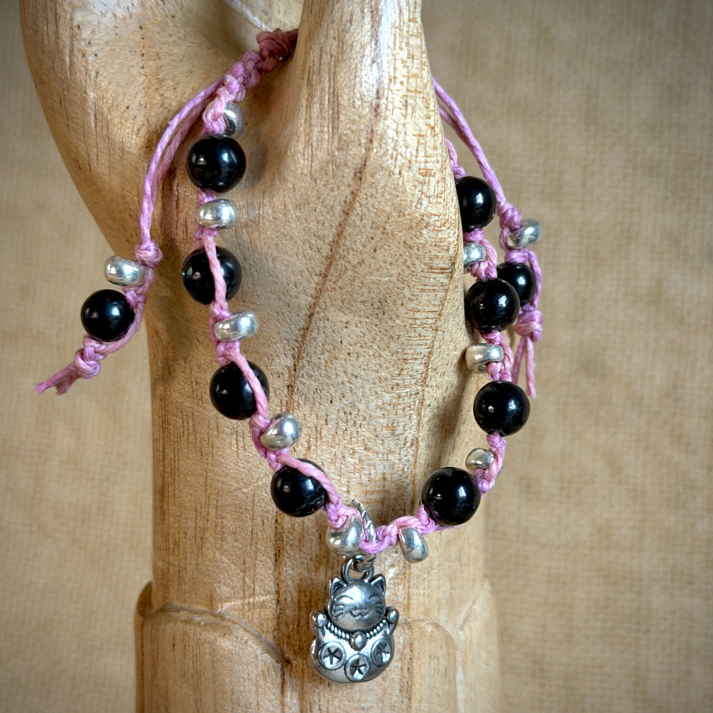 Maneki Neko Shungite Bracelet  draped on wooden arm