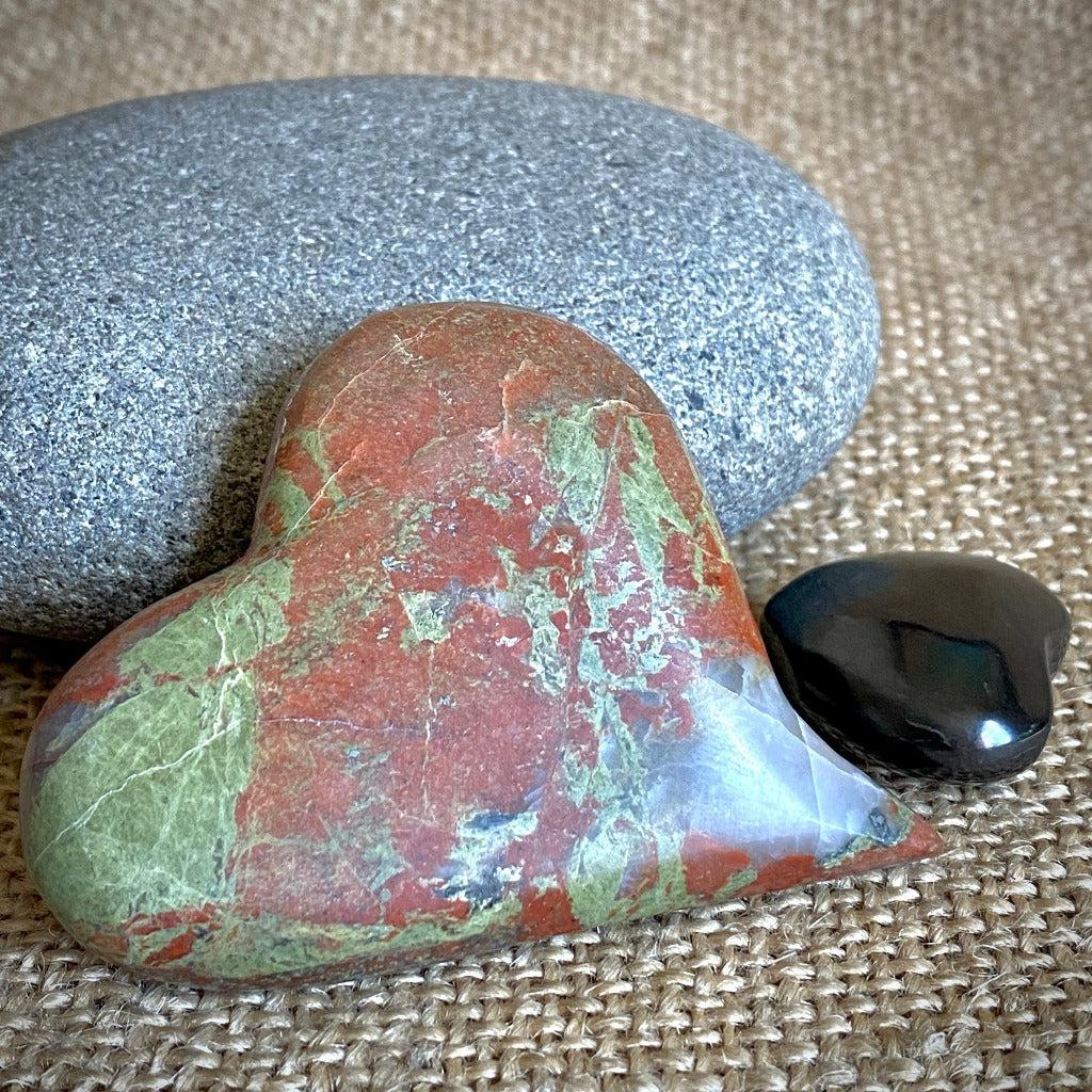 Playful Carved Stone Heart & Black Shungite Heart on Mahogany Stand