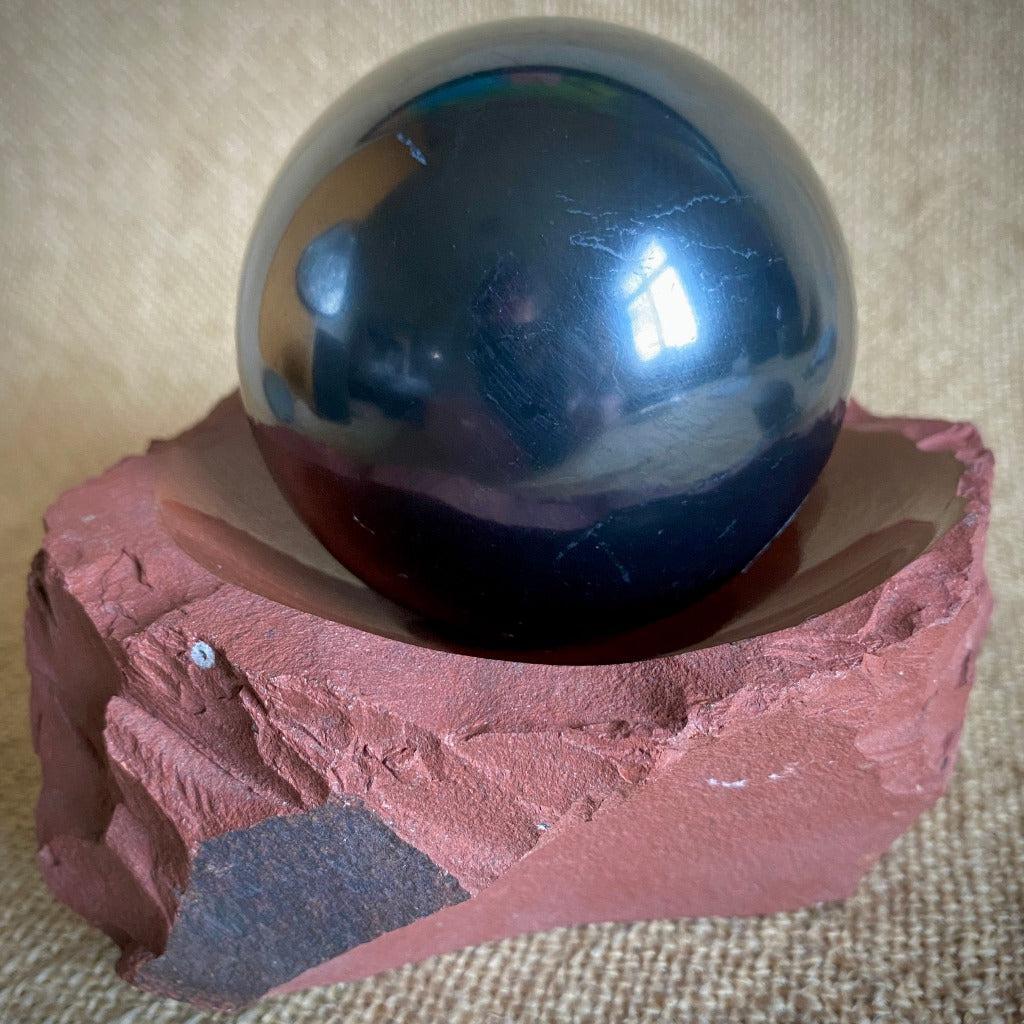 Polished Shungite Sphere 3 Inch in Fabulous Red Jasper Bowl