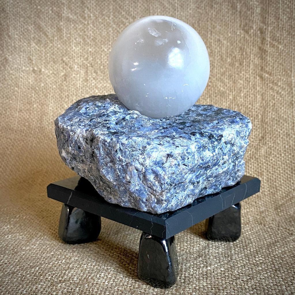 Selenite Sphere & Rough Sodalite Block on Polished Black Shungite Stand