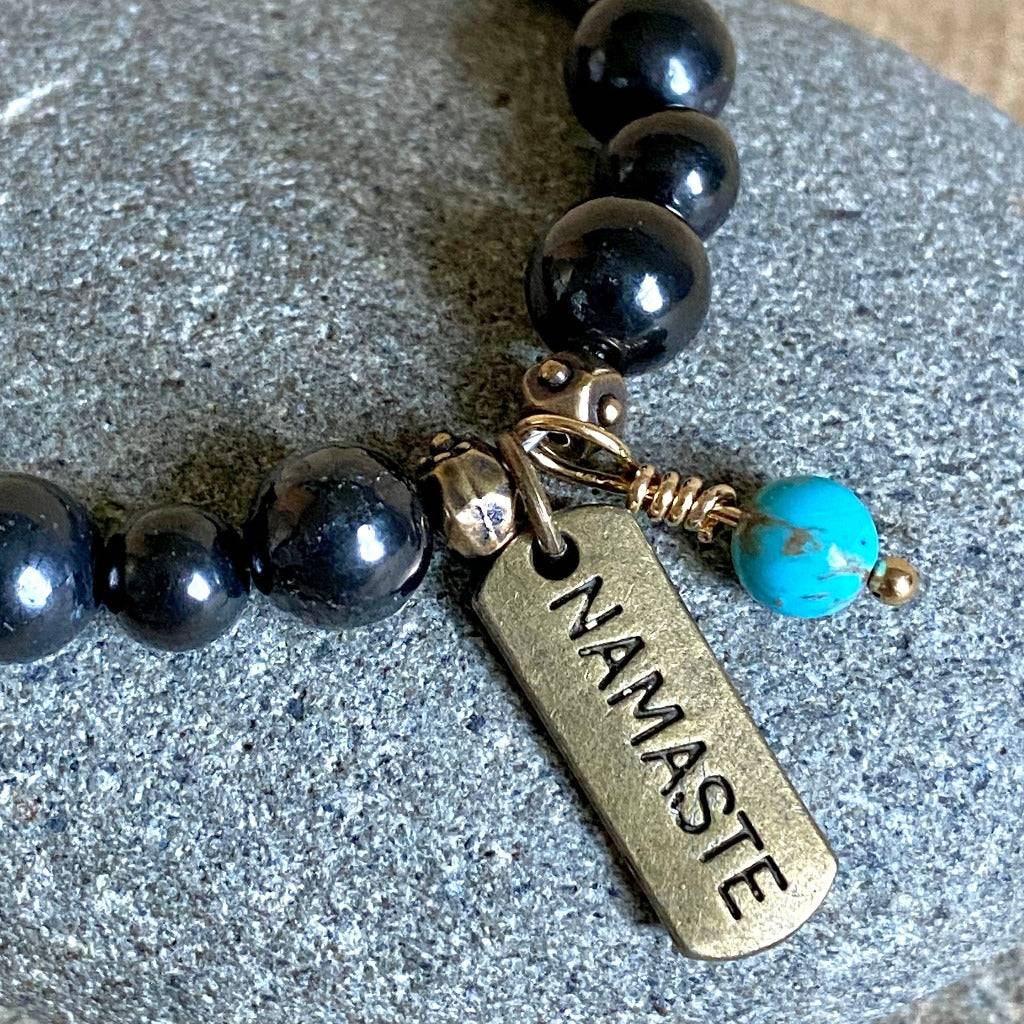 Shungite Namaste Bracelet with Turquoise Bead Dangle close-up