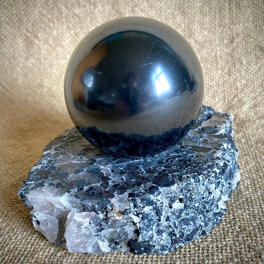 Shungite Sphere 3 Inch on Tourmalinated Quartz Tea Lite Stand