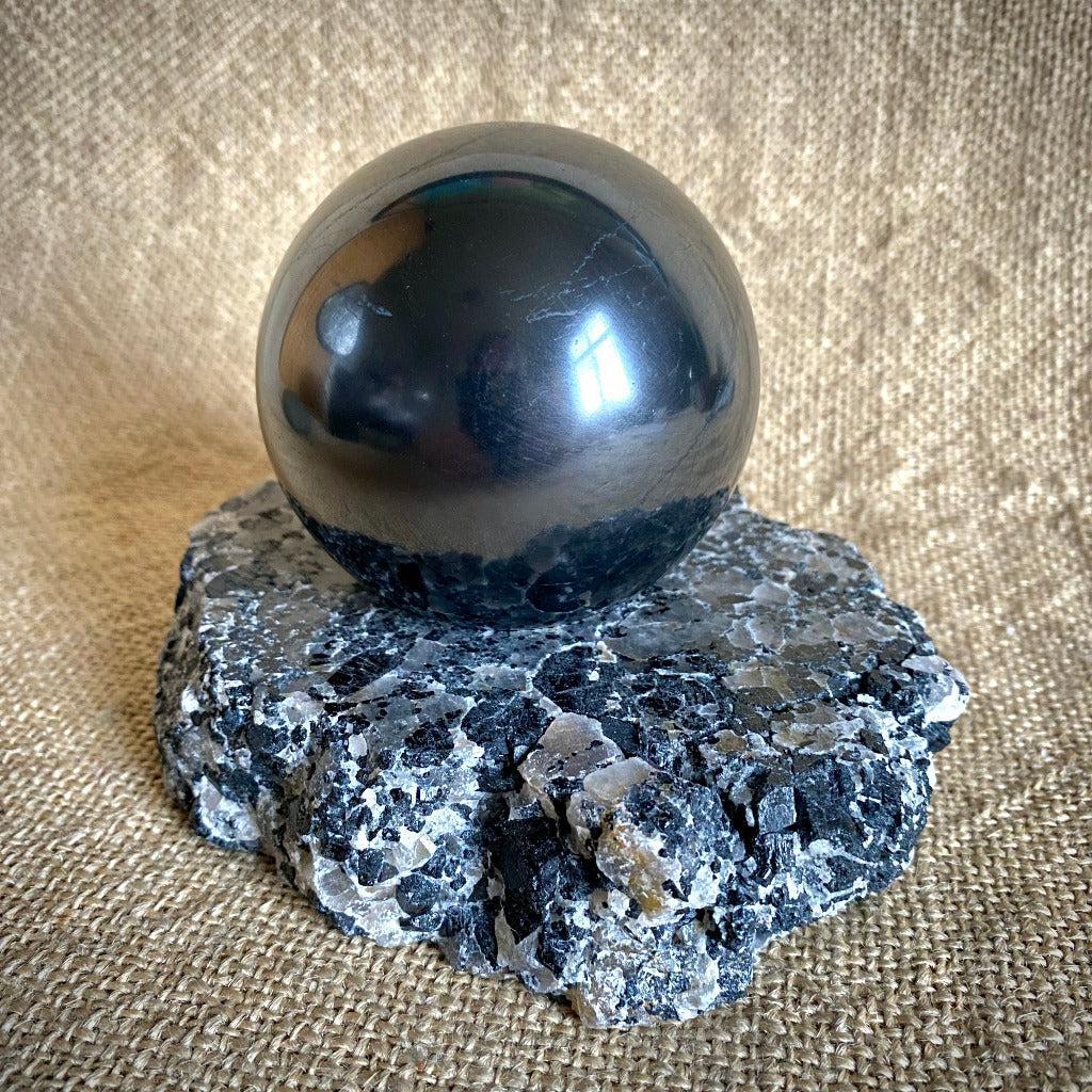 Shungite Sphere 3 Inch on Tourmalinated Quartz Tea Lite Stand