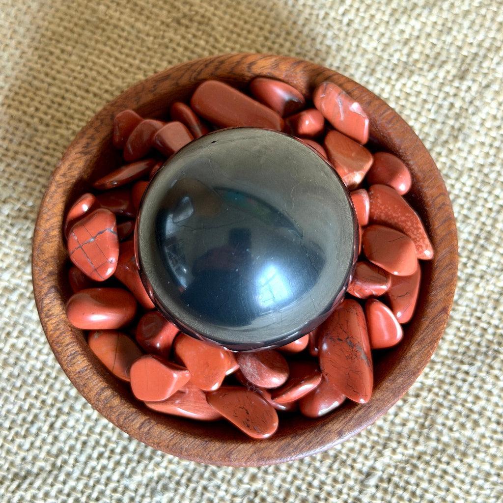 Shungite Sphere on Tumbled Red Jasper | Custom Mahogany Wood Bowl