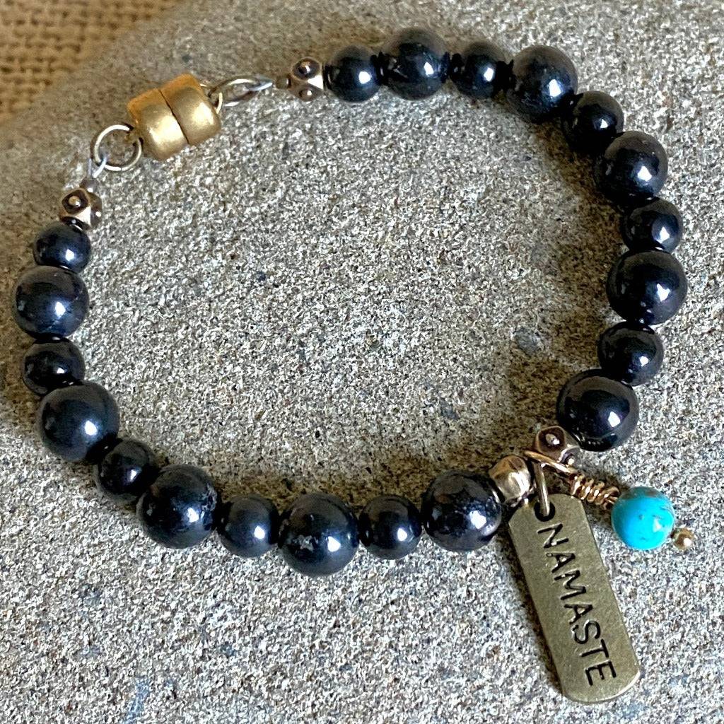 Shungite Namaste Bracelet | Brass Namaste Charm,Turquoise Bead Dangle top view
