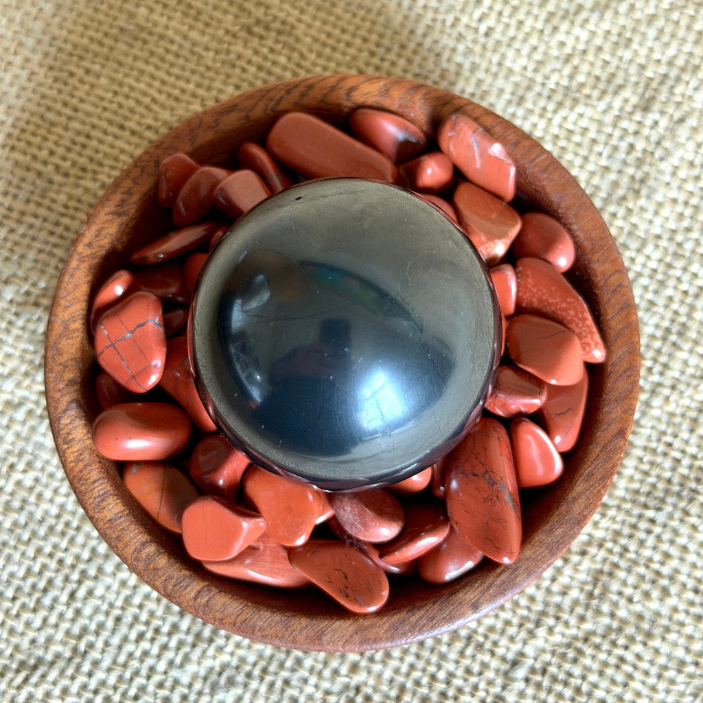 Shungite Sphere on Tumbled Red Jasper 2