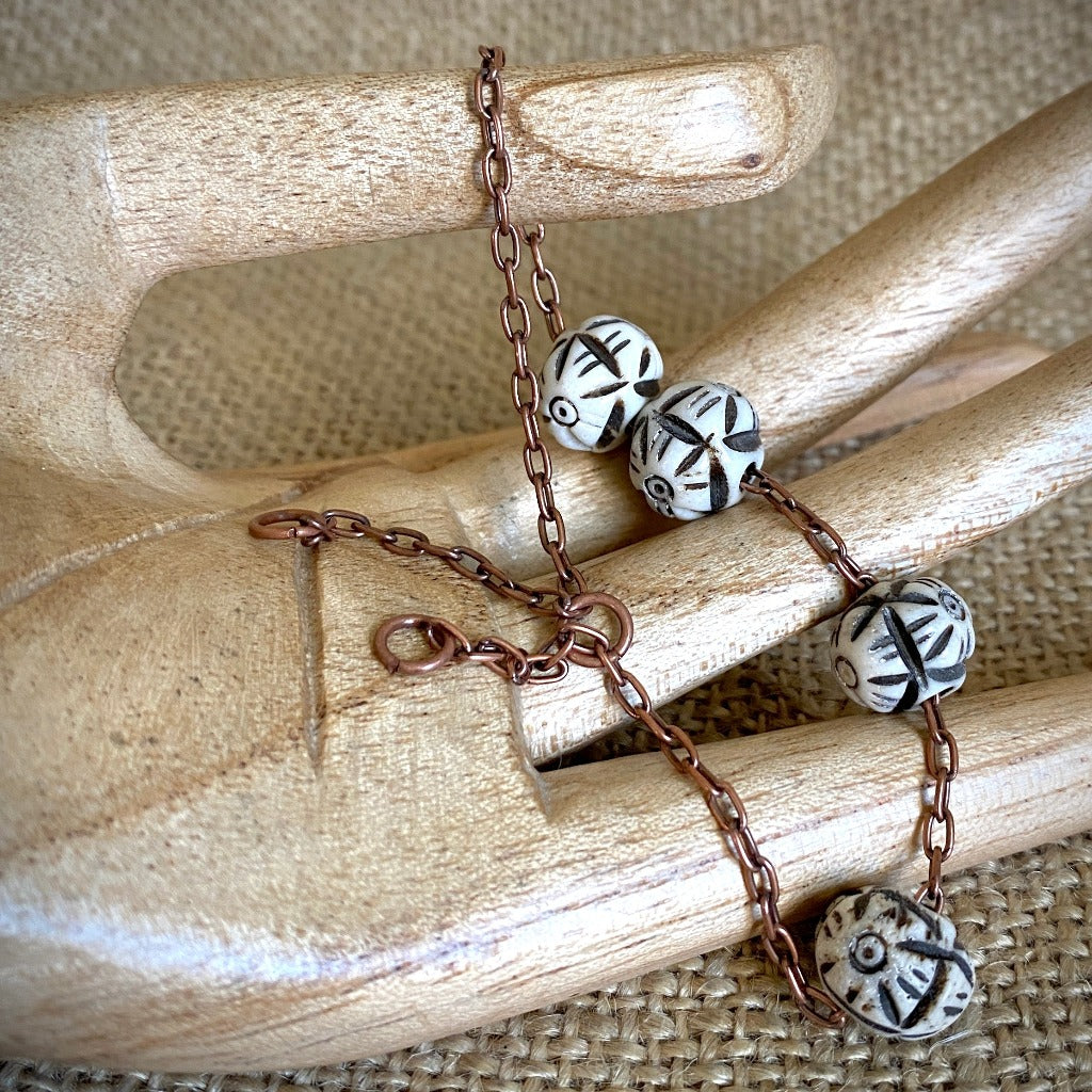 Medium Copper Topper with Black & White Carved Bone Beads