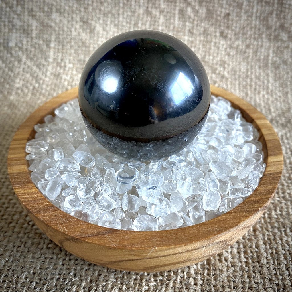 Shungite Sphere on Bed of Microtumbled Crystal in Olive Wood Bowl, - Shungite Queen