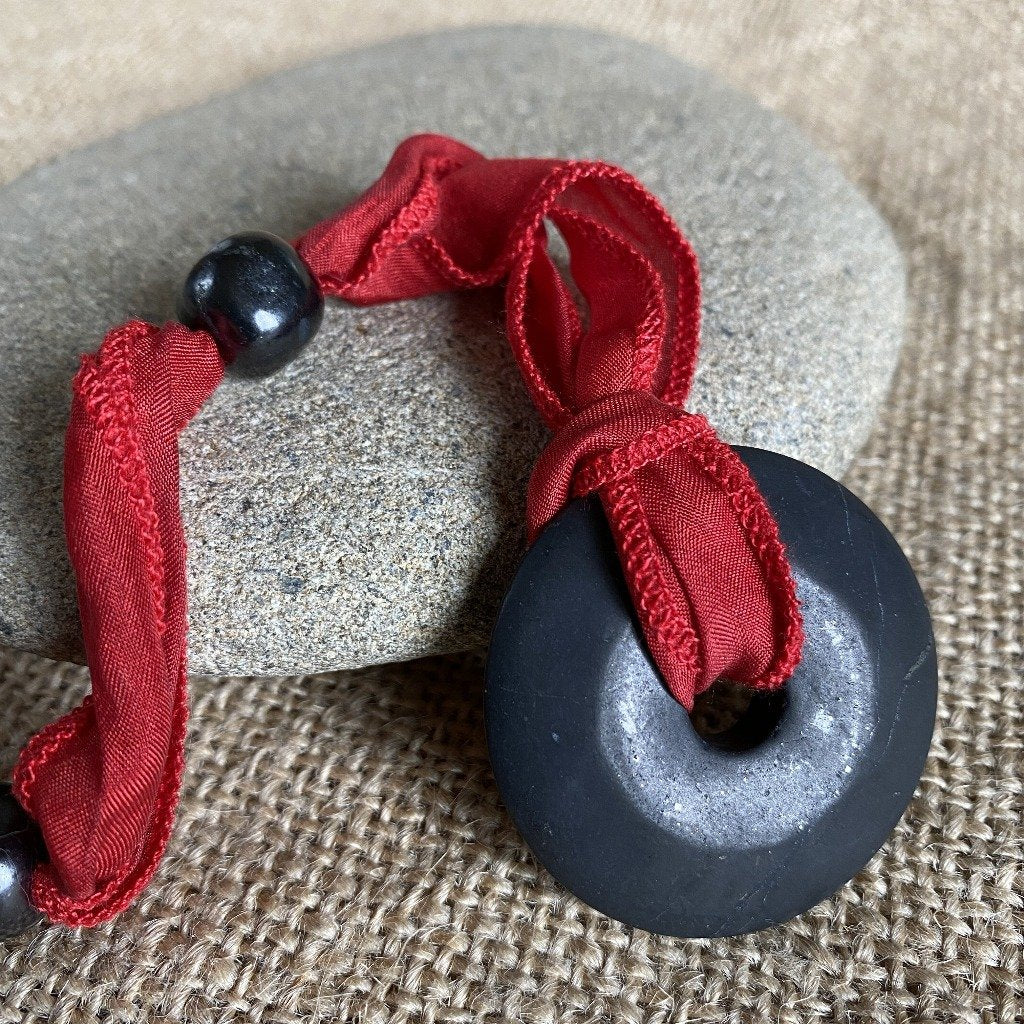 Hangable Shungite Donut Accessory on Hand-Dyed Red Silk