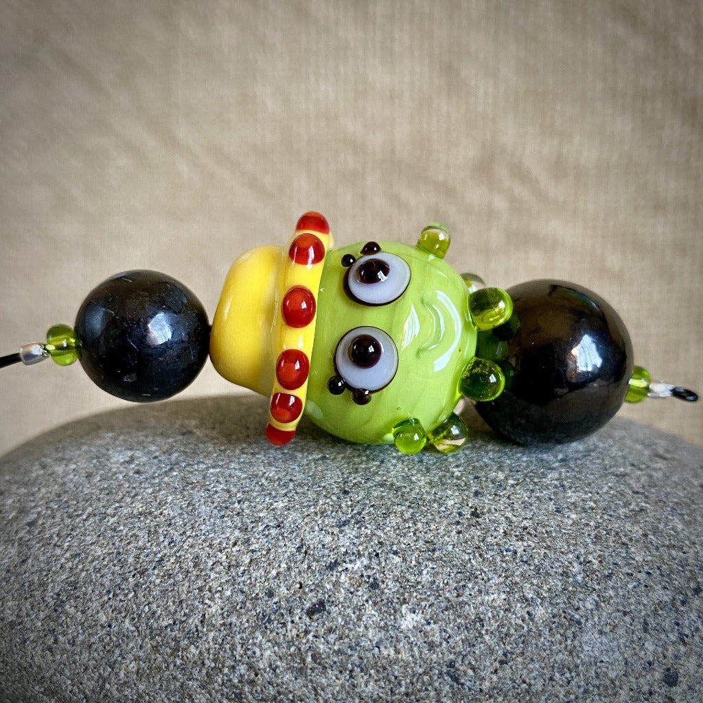Hangable EMF Accessory w/Shungite, Lime Green "Squeedle" in Yellow Hat