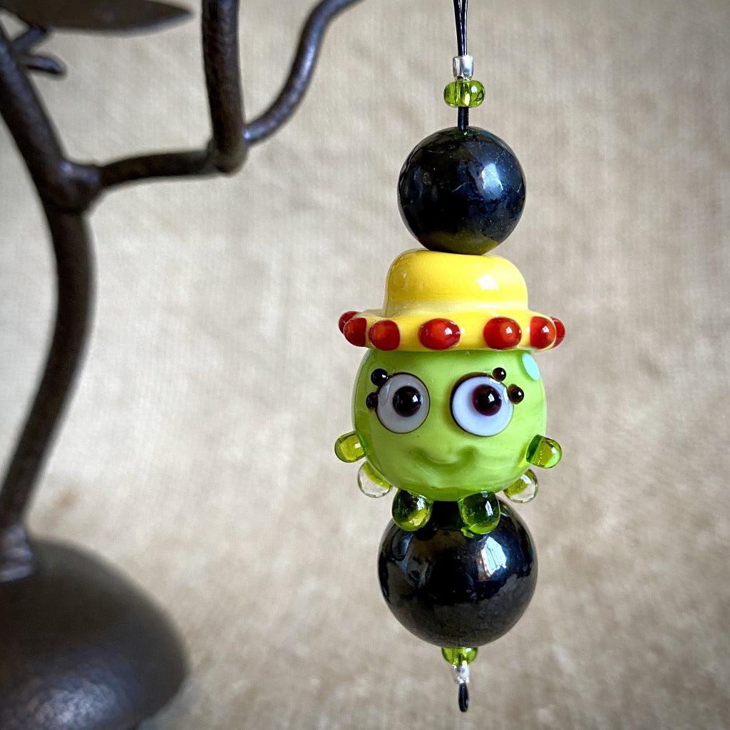 Hangable EMF Accessory w/Shungite, Lime Green "Squeedle" in Yellow Hat