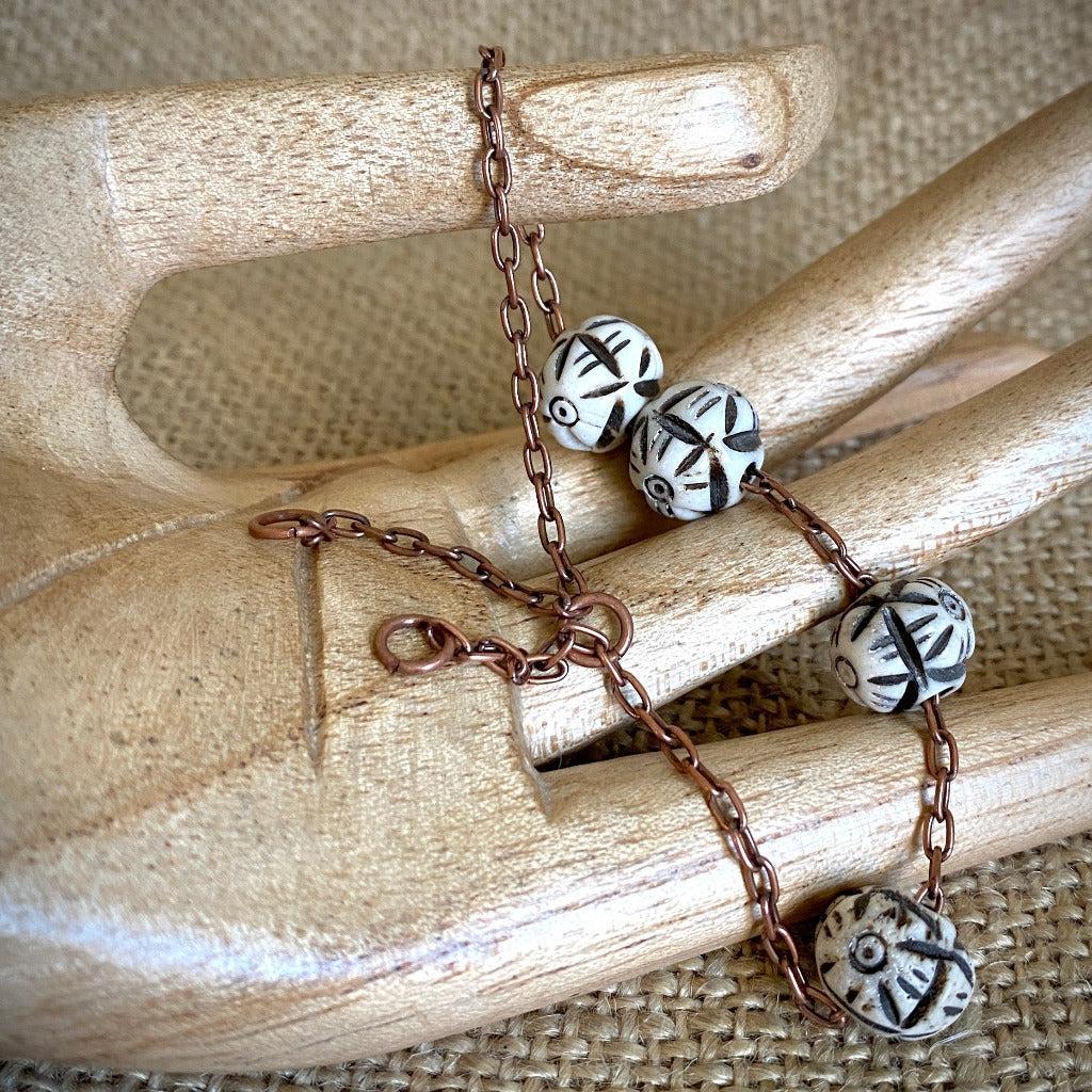 Medium Copper Topper with Black & White Carved Bone Beads